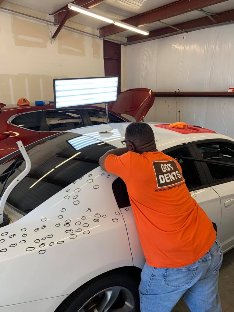 White Dodge Sedan Hail Damage Assessment